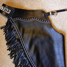 Black chaps with lots of gray accent. Beaded back