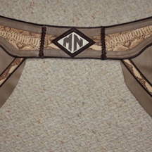 Tan chaps with snake inlay.
